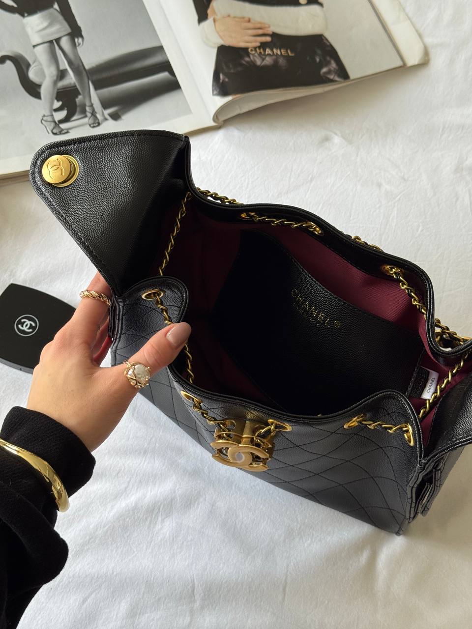 Chanel 25 Handbag in Black With Gold Hardware - 17